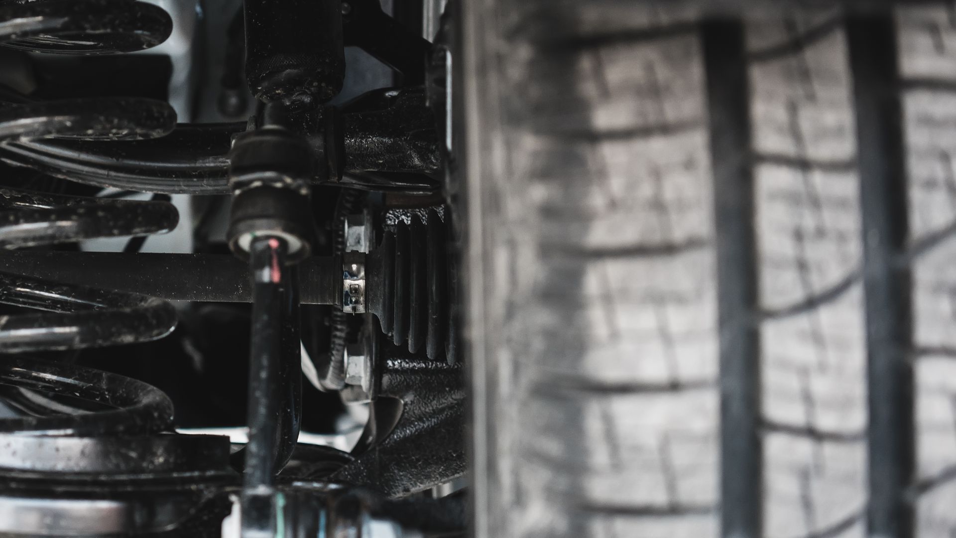 A close up of a car's front suspension