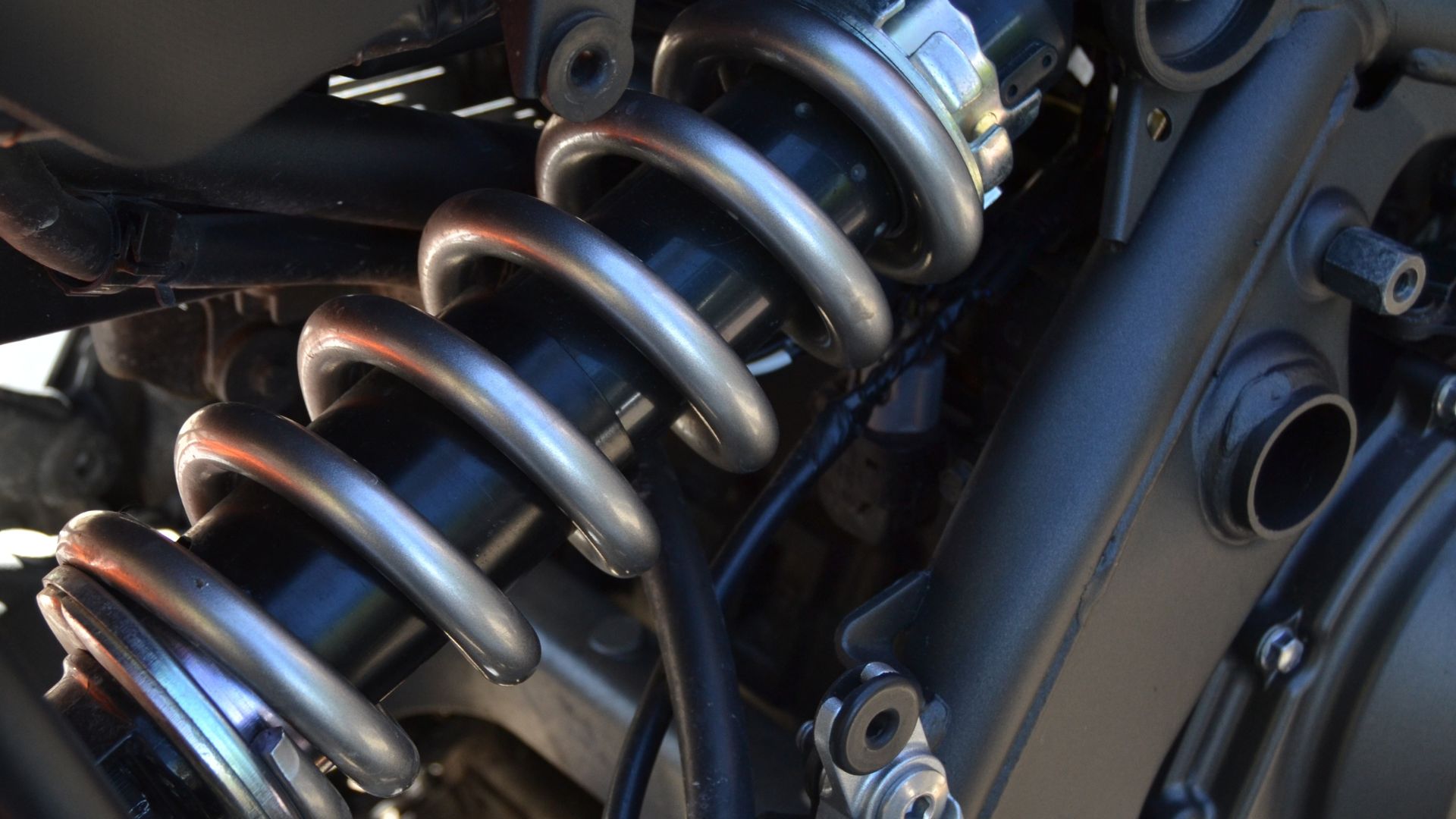 A close up of a motorcycle's front suspension